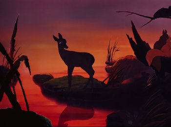 Movie still from “Bambi” (1942), directed by David Hand – A deer standing on a rock in the middle of a body of water at sunset; Wide shot, Low angle