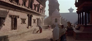 Movie still from “Baraka” (1992), directed by Ron Fricke – A group of people standing on top of a brick walkway; Extreme Wide shot, Low angle