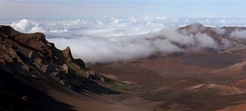Movie still from “Baraka” (1992), directed by Ron Fricke – A view of a valley with a mountain in the background; Extreme Wide shot, High angle