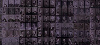 Movie still from “Baraka” (1992), directed by Ron Fricke – A black and white photo of many different faces; Medium shot, Overhead angle