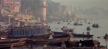 Movie still from “Baraka” (1992), directed by Ron Fricke – A group of boats floating on top of a body of water; Extreme Wide shot, High angle