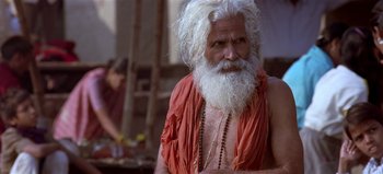 Movie still from “Baraka” (1992), directed by Ron Fricke – An old man with a long white beard; Close Up shot, Low angle