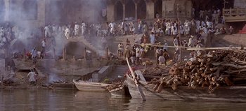 Movie still from “Baraka” (1992), directed by Ron Fricke – A group of people standing on top of a dock; Extreme Wide shot, High angle