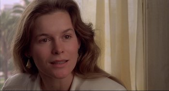 Movie still from “Barfly” (1987), directed by Barbet Schroeder – A person with long hair; Close Up shot, Over the shoulder angle