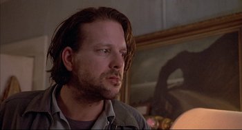 Movie still from “Barfly” (1987), directed by Barbet Schroeder – A person with long brown hair; Close Up shot, Low angle