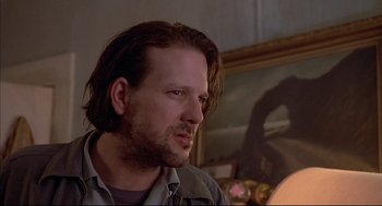 Movie still from “Barfly” (1987), directed by Barbet Schroeder – A person with long brown hair; Close Up shot, Low angle