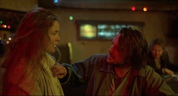 Movie still from “Barfly” (1987), directed by Barbet Schroeder – A man and a woman are looking at each other; Close Up shot, Over the shoulder angle