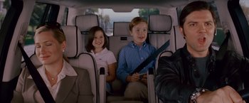 Movie still from “Step Brothers” (2008), directed by Adam McKay – Two children sitting in the back seat of a car; Medium shot, High angle