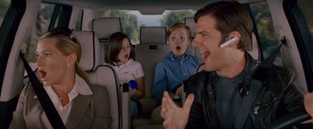 Movie still from “Step Brothers” (2008), directed by Adam McKay – A man sitting in a car with two children; Medium shot, Over the shoulder angle