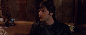 Movie still from “Step Brothers” (2008), directed by Adam McKay – A person wearing a leather jacket; Close Up shot, Over the shoulder angle