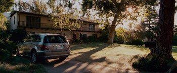 Movie still from “Step Brothers” (2008), directed by Adam McKay – A car is parked in front of a house; Extreme Wide shot, High angle