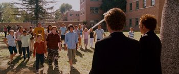 Movie still from “Step Brothers” (2008), directed by Adam McKay – A group of people standing in a field; Wide shot, High angle