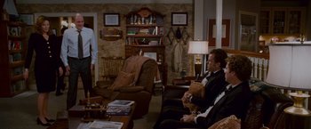 Movie still from “Step Brothers” (2008), directed by Adam McKay – Two men sitting in chairs in a living room; Wide shot, Over the shoulder angle