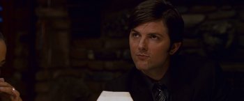 Movie still from “Step Brothers” (2008), directed by Adam McKay – A person wearing a suit and tie; Close Up shot, Over the shoulder angle