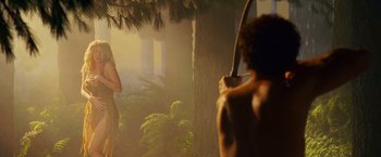 Movie still from “Step Brothers” (2008), directed by Adam McKay – A man holding a bow and arrow in a forest; Medium shot, Over the shoulder angle