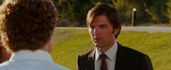 Movie still from “Step Brothers” (2008), directed by Adam McKay – A man in a business suit talking to another man in a business suit; Close Up shot, Over the shoulder angle