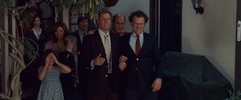 Movie still from “Step Brothers” (2008), directed by Adam McKay – Three men in suits and ties standing next to each other; Medium shot, High angle