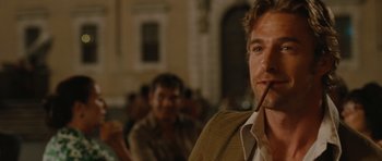 Movie still from “Barney's Version” (2010), directed by Richard J. Lewis – A person holding a pipe; Close Up shot, Over the shoulder angle