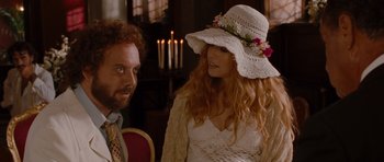 Movie still from “Barney's Version” (2010), directed by Richard J. Lewis – A man and a woman wearing a white hat; Medium shot, Over the shoulder angle