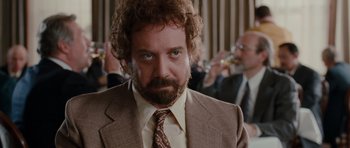 Movie still from “Barney's Version” (2010), directed by Richard J. Lewis – A person wearing a suit and tie; Close Up shot, Low angle