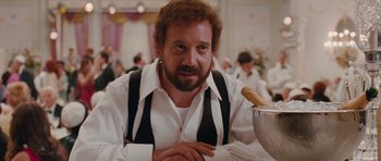 Movie still from “Barney's Version” (2010), directed by Richard J. Lewis – A man sitting at a table with food on top of it; Close Up shot, Over the shoulder angle