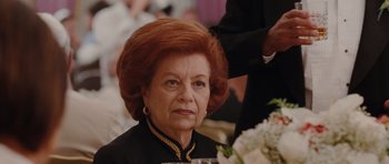 Movie still from “Barney's Version” (2010), directed by Richard J. Lewis – An older woman with red hair sitting at a table; Close Up shot, Over the shoulder angle