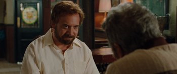 Movie still from “Barney's Version” (2010), directed by Richard J. Lewis – A man in a white shirt talking to another man in a white shirt; Close Up shot, Over the shoulder angle