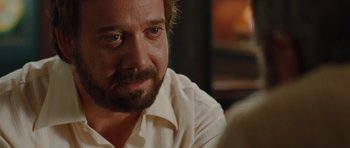 Movie still from “Barney's Version” (2010), directed by Richard J. Lewis – A person wearing a white shirt; Close Up shot, Over the shoulder angle