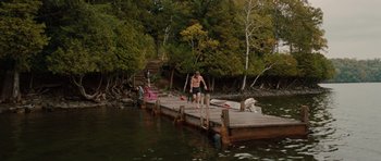 Movie still from “Barney's Version” (2010), directed by Richard J. Lewis – A man standing on a pier next to a body of water; Wide shot, High angle