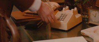 Movie still from “Barney's Version” (2010), directed by Richard J. Lewis – A hand is on a phone on a desk; Extreme Close Up shot, High angle