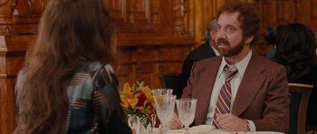 Movie still from “Barney's Version” (2010), directed by Richard J. Lewis – A man sitting at a dinner table with a woman; Medium shot, Over the shoulder angle