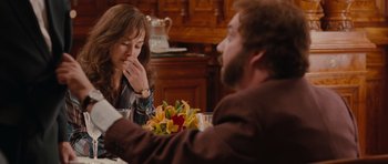 Movie still from “Barney's Version” (2010), directed by Richard J. Lewis – A man and a woman sitting at a dinner table; Medium shot, Over the shoulder angle