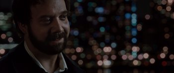 Movie still from “Barney's Version” (2010), directed by Richard J. Lewis – A person wearing a suit and tie; Close Up shot, Over the shoulder angle