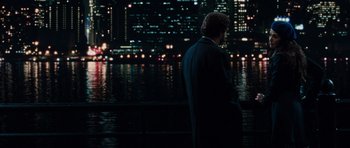Movie still from “Barney's Version” (2010), directed by Richard J. Lewis – A man standing in front of a body of water at night; Wide shot, Over the shoulder angle