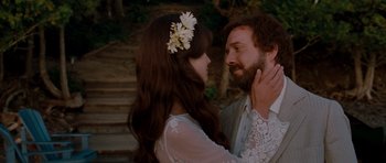 Movie still from “Barney's Version” (2010), directed by Richard J. Lewis – A man and a woman standing next to each other in front of stairs; Close Up shot, Over the shoulder angle