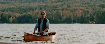 Movie still from “Barney's Version” (2010), directed by Richard J. Lewis – A man is in a boat in the water; Wide shot, Over the shoulder angle