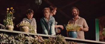 Movie still from “Barney's Version” (2010), directed by Richard J. Lewis – A group of people standing on top of a building; Medium shot, Low angle