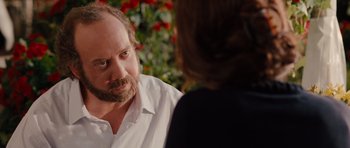 Movie still from “Barney's Version” (2010), directed by Richard J. Lewis – A man and a woman are sitting at a table; Close Up shot, Over the shoulder angle