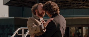 Movie still from “Barney's Version” (2010), directed by Richard J. Lewis – A couple of men standing next to each other; Medium shot, Over the shoulder angle