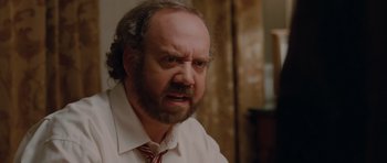 Movie still from “Barney's Version” (2010), directed by Richard J. Lewis – A man with a beard and a red neck tie; Close Up shot, Over the shoulder angle