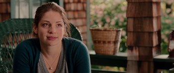 Movie still from “Barney's Version” (2010), directed by Richard J. Lewis – A beautiful young lady sitting on top of a wooden bench; Close Up shot, Over the shoulder angle
