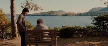Movie still from “Barney's Version” (2010), directed by Richard J. Lewis – A man sitting on a bench looking out at the water; Extreme Wide shot, High angle