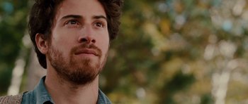 Movie still from “Barney's Version” (2010), directed by Richard J. Lewis – A person with a beard looking to his left; Close Up shot, Over the shoulder angle