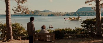 Movie still from “Barney's Version” (2010), directed by Richard J. Lewis – Two people sitting on a bench looking out at a lake; Extreme Wide shot, Over the shoulder angle