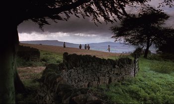 Movie still from “Barry Lyndon” (1975), directed by Stanley Kubrick – A group of people riding horses down a dirt road; Extreme Wide shot, High angle