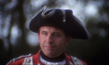 Movie still from “Barry Lyndon” (1975), directed by Stanley Kubrick – A person wearing a uniform and a hat; Close Up shot, Low angle
