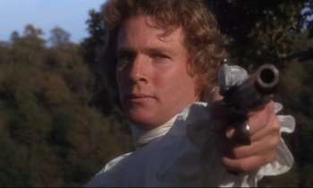 Movie still from “Barry Lyndon” (1975), directed by Stanley Kubrick – A person holding a gun; Close Up shot, Low angle
