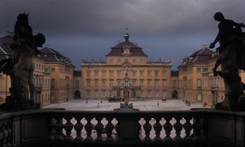 Movie still from “Barry Lyndon” (1975), directed by Stanley Kubrick – A large building with a clock on the top of it; Extreme Wide shot, Low angle