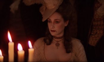 Movie still from “Barry Lyndon” (1975), directed by Stanley Kubrick – A woman with a hat and a candle in the background; Close Up shot, Over the shoulder angle