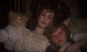 Movie still from “Barry Lyndon” (1975), directed by Stanley Kubrick – A woman and a child are posed for a picture; Close Up shot, High angle